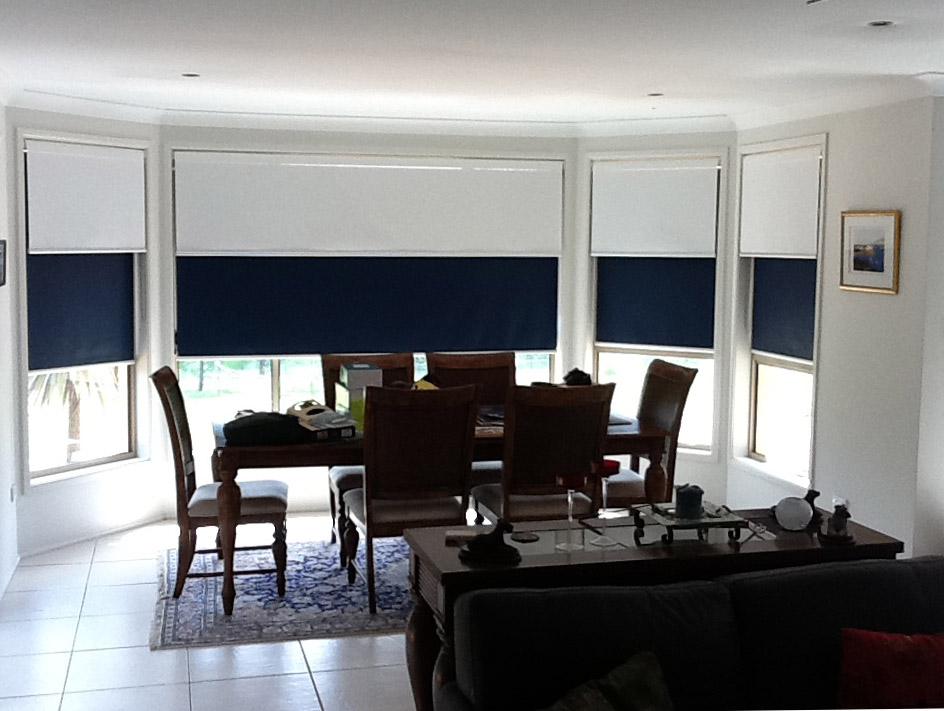 Dual roller blinds in living area
